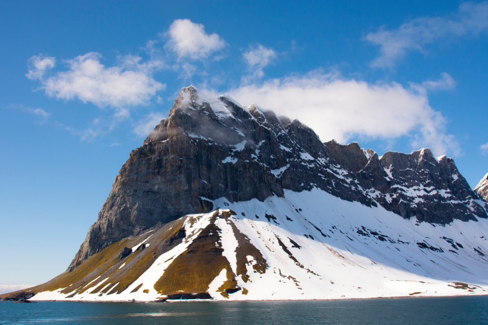 Norway.,Svalbard.,Hornsund.,Dramatic,Cliffs,Tower,Over,The,Sound.